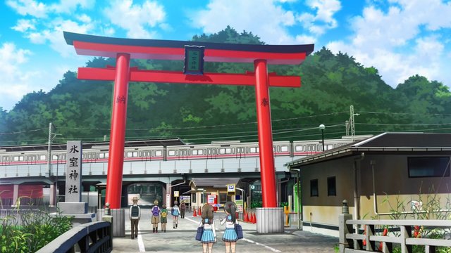 In front of the shrine torii gate